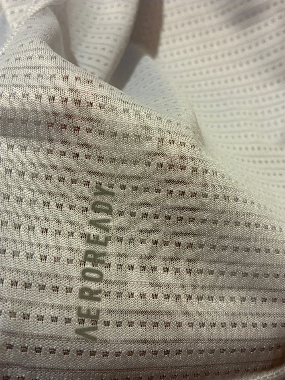 adidas Aeroready Men’s running tee in a light gray and signature stripes.